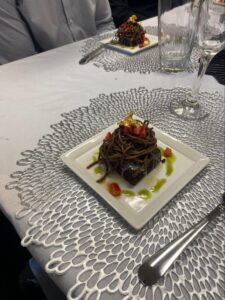 Artfully plated dessert served at a private event inside Ovico Gallery, a wall art gallery in St. Augustine known for blending fine art prints with curated cultural experiences.